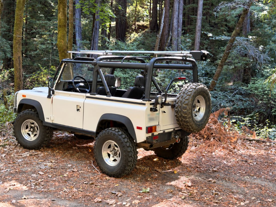 Carrier on a white 4x4 in the redwoods