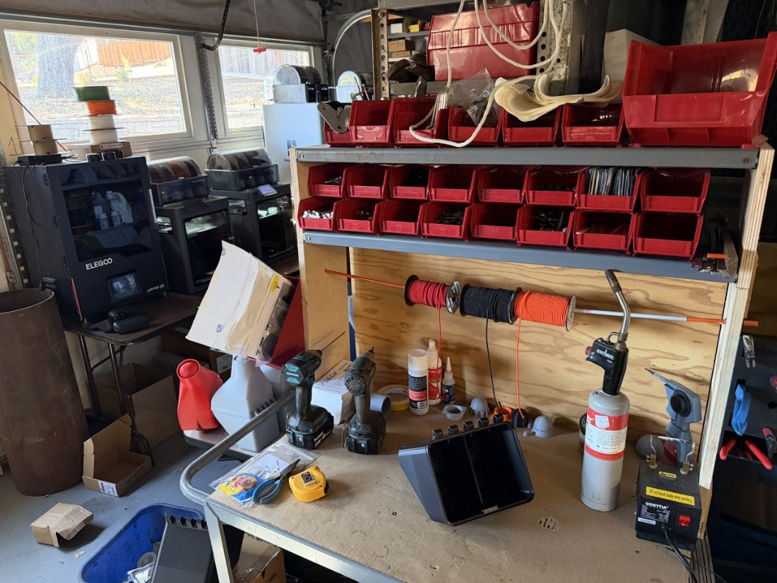 3D printers and parts bench in the workshop